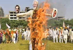 modi ambani adani ravan fire