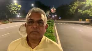 Dilip Ghosh on road at night