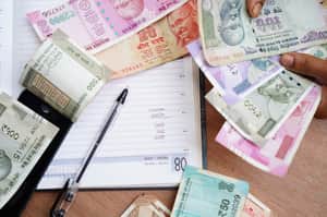 Money Indian rupee work diary